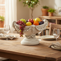 Decorative fruit bowl with fruits on a wooden table in a dining room setting