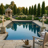 Garden with pool, bench, and decorative elements