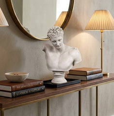 Console table with decorative items in a living room setting