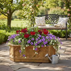Decorative stone planter with flowers on a patio