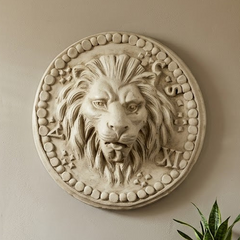 Decorative lion head wall art above a wooden console table with a plant and small items.