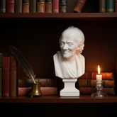Bust of a philosopher on a shelf with books and a candle