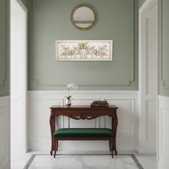 Decorative hallway with a wooden console table and green bench against a green wall.
