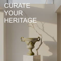 Decorative urn on a pedestal with branches against a neutral wall, text 'Curate Your Heritage' displayed.