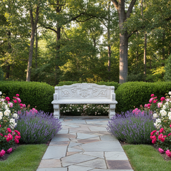 Stone bench in a garden with flowers and trees