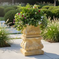 Decorative stone planter with flowers in a garden setting