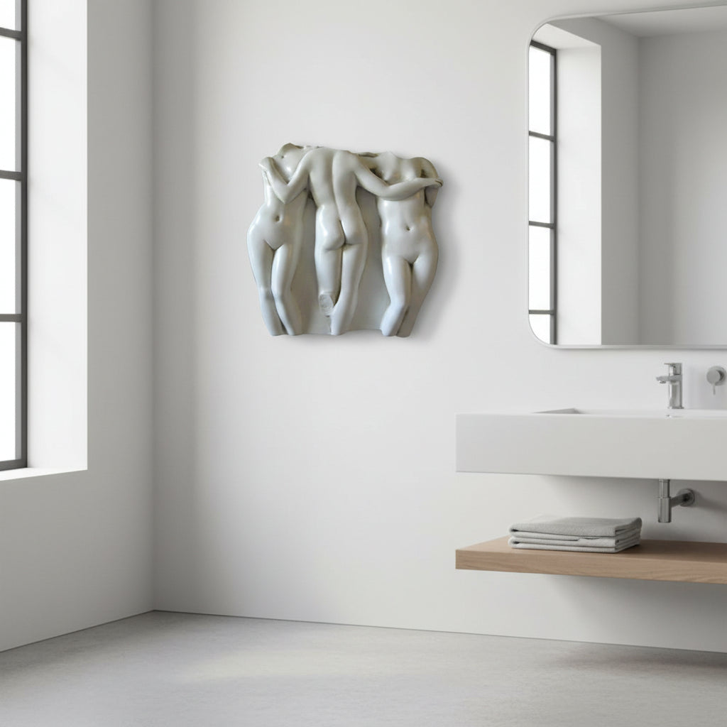 Modern bathroom with sculpture on the wall and sink area.