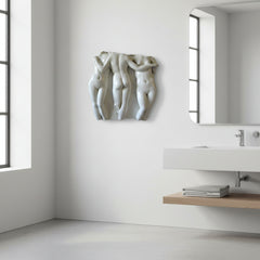 Modern bathroom with sculpture on the wall and sink area.