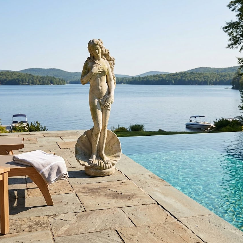 Venus Statue by a pool with a scenic lake view
