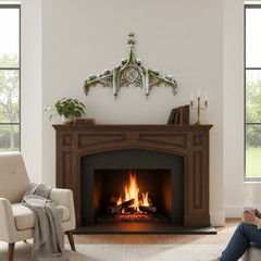 Cozy living room with a fireplace, armchair, and person sitting on a couch.