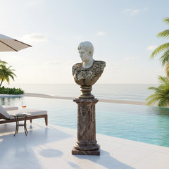 Statue of a classical bust on a pedestal by a pool with palm trees and lounge chairs.