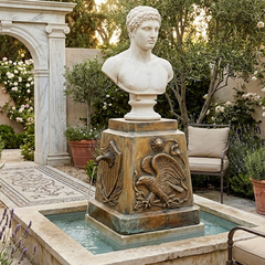 Bust on a pedestal in a garden setting with seating and decorative elements.