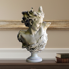 A classical-style bust sculpture of a woman with flowing hair, displayed on a dark wood console table against a beige wall with a large framed picture.