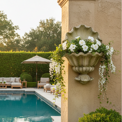 Pool area with garden furniture, flowers, and a pool.