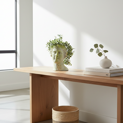 Wooden console table with decorative items in a bright room
